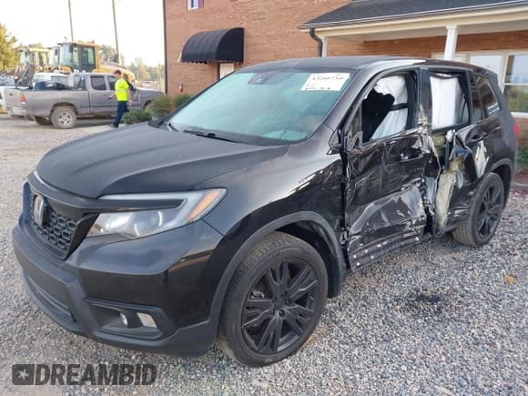 ✅ 2021 Honda Passport Sport • VIN: 5FNYF7H28MB011609 • Lot: 43266734. Listed on IAAI with 69,477 mi. Free auction sales archive from the USA and detailed vehicle history report at DreamBid. Image 2.