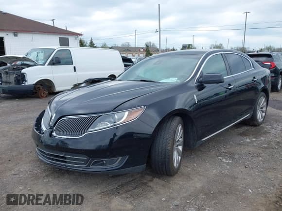 ✅ 2014 Lincoln MKS • VIN: 1LNHL9EK9EG601748 • Lot: 42133600. Listed on IAAI with 136,128 mi. Free auction sales archive from the USA and detailed vehicle history report at DreamBid. Image 2.