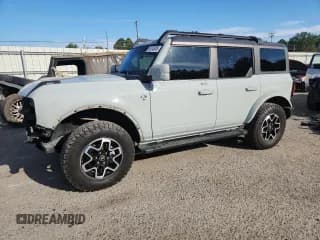 ✅ 2022 Ford Bronco Wildtrak • VIN: 1FMEE5DP0NLB31183 • Lot: 85745005. Listed on Copart with 56,814 mi. Free auction sales archive from the USA and detailed vehicle history report at DreamBid. Image 1.