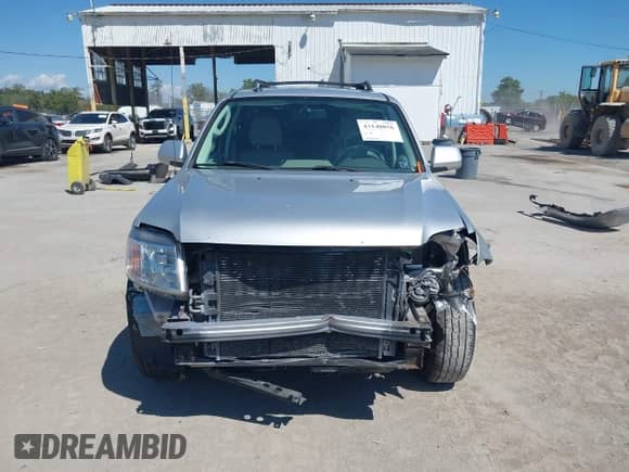 2010 Mercury Mariner Premier z VIN 4M2CN9HGXAKJ16116, wystawiony jako IAAI lot #43140056 z przebiegiem 194 370 mil mil oraz . Historia ofert i sprzedaży dostępna na DreamBid. Obrazek 13.