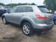 ✅ 2012 Mazda CX-9 Grand Touring • VIN: JM3TB2DA1C0345779 • Lot: 42458552. Wystawiony na IAAI z przebiegiem 215 126 mil. Bezpłatny archiwum sprzedaży aukcyjnych z USA i szczegółowy raport historii pojazdu na DreamBid. Zdjęcie 3.