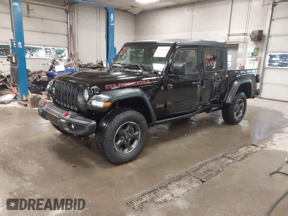 ✅ 2022 Jeep Gladiator Rubicon • VIN: 1C6JJTBGXNL112413 • Lot: 41142645. Listed on IAAI with 57,971 mi. Free auction sales archive from the USA and detailed vehicle history report at DreamBid. Image 2.