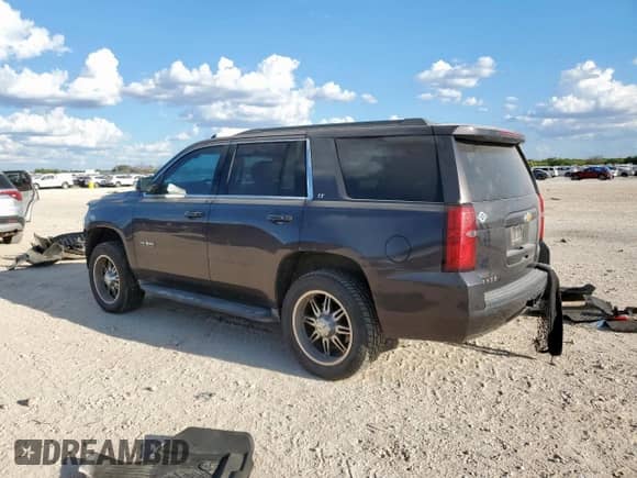 2015 Chevrolet Tahoe LT z VIN 1GNSCBKC9FR633675, wystawiony jako Copart lot #81702415 z przebiegiem 153 617 mil mil oraz Szkoda całkowita • Salvage title. Historia ofert i sprzedaży dostępna na DreamBid. Obrazek 2.