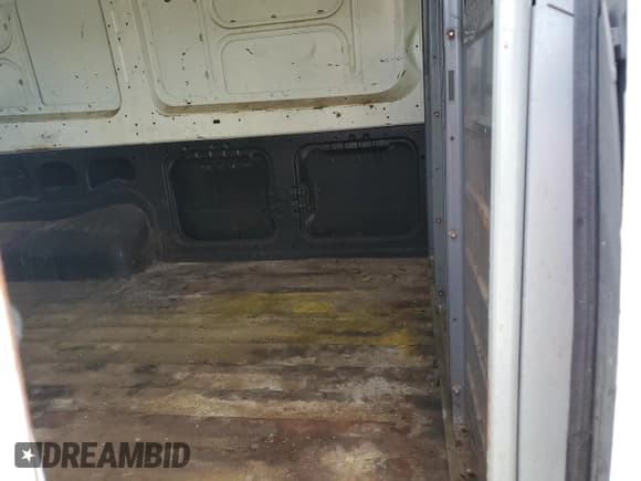 ✅ 2014 Nissan NV Cargo SV • VIN: 1N6BF0KM7EN100725 • Lot: 70743074. Listed on Copart with 124,762 mi. Free auction sales archive from the USA and detailed vehicle history report at DreamBid. Image 11.