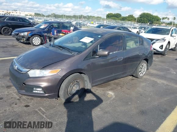 ✅ 2013 Honda Insight LX • VIN: JHMZE2H58DS001247 • Lot: 43801615. Listed on IAAI with 113,454 mi. Free auction sales archive from the USA and detailed vehicle history report at DreamBid. Image 2.