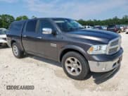 ✅ 2015 Ram 1500 Laramie • VIN: 1C6RR6NM6FS521272 • Lot: 69978965. Listed on Copart with 226,243 mi. Free auction sales archive from the USA and detailed vehicle history report at DreamBid. Image 4.