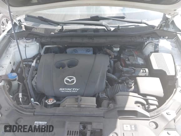 ✅ 2015 Mazda CX-5 Touring • VIN: JM3KE2CY1F0456676 • Lot: 41961058. Listed on IAAI with 140,018 mi. Free auction sales archive from the USA and detailed vehicle history report at DreamBid. Image 10.