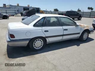 ✅ 1989 Ford Taurus GL • VIN: 1FABP52UXKG244224 • Лот: 59239225. Опубликован ранее на Copart с пробегом 30 853 миль. Бесплатный доступ к архиву аукционных продаж из США и подробный отчёт об истории автомобиля на DreamBid. Изображение 3.