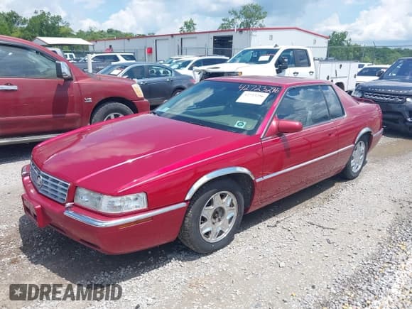 ✅ 2001 Cadillac Eldorado ESC • VIN: 1G6EL12Y31B107932 • Lot: 42723296. Wystawiony na IAAI z przebiegiem 152 482 mil. Bezpłatny archiwum sprzedaży aukcyjnych z USA i szczegółowy raport historii pojazdu na DreamBid. Zdjęcie 2.