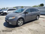 ✅ 2012 Honda Odyssey Touring • VIN: 5FNRL5H9XCB109229 • Lot: 59885895. Listed on Copart with 153,668 mi. Free auction sales archive from the USA and detailed vehicle history report at DreamBid. Image 1.