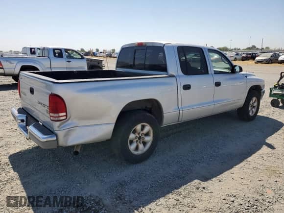 2004 Dodge Dakota SLT with VIN 1D7HL48K44S780575, listed as a Copart auction lot 57872335 with 148,785 mi miles and Salvage title. Bid and sale history available at DreamBid. Image 3.