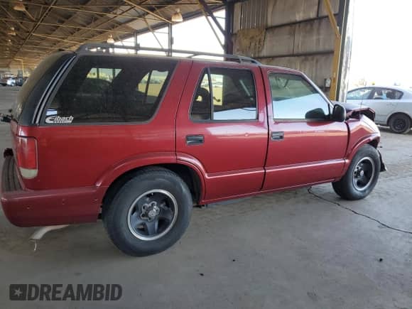 1995 Chevrolet Blazer z VIN 1GNCS13W8S2238495, wystawiony jako Copart lot #74829034 z przebiegiem 199 884 mil mil oraz Szkoda całkowita • Salvage title. Historia ofert i sprzedaży dostępna na DreamBid. Obrazek 3.
