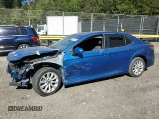 2019 Toyota Camry LE with VIN 4T1B11HK7KU264700, listed as a Copart auction lot 85474625 with 128,420 mi miles and Salvage title. Bid and sale history available at DreamBid. Image 1.