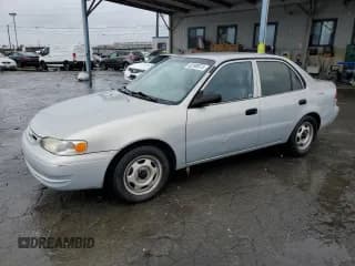 ✅ 2000 Toyota Corolla VE • VIN: 1NXBR12E1YZ414448 • Лот: 82390975. Опубликован ранее на Copart с пробегом 106 255 миль. Бесплатный доступ к архиву аукционных продаж из США и подробный отчёт об истории автомобиля на DreamBid. Изображение 1.