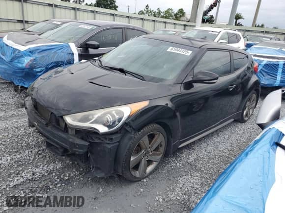 2013 Hyundai Veloster Turbo с VIN KMHTC6AE8DU178833, выставлен на аукционе Copart как лот 61944125 с пробегом 149 564 миль миль и Списание • Salvage title. История ставок и продаж доступна на DreamBid. Изображение 1.