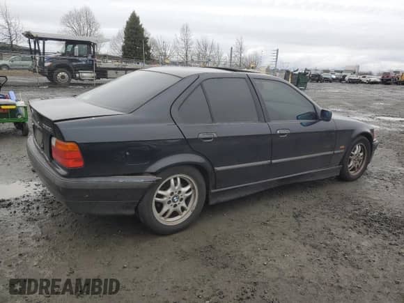 1998 BMW 3 Series 328i with VIN WBACD4327WAV64492, listed as a Copart auction lot 43583785 with 148,128 mi miles and Salvage title. Bid and sale history available at DreamBid. Image 3.