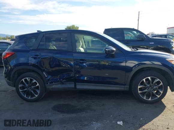 ✅ 2016 Mazda CX-5 Grand Touring • VIN: JM3KE2DY8G0866133 • Лот: 43474326. Опубликован ранее на IAAI с пробегом 164 072 миль. Бесплатный доступ к архиву аукционных продаж из США и подробный отчёт об истории автомобиля на DreamBid. Изображение 13.