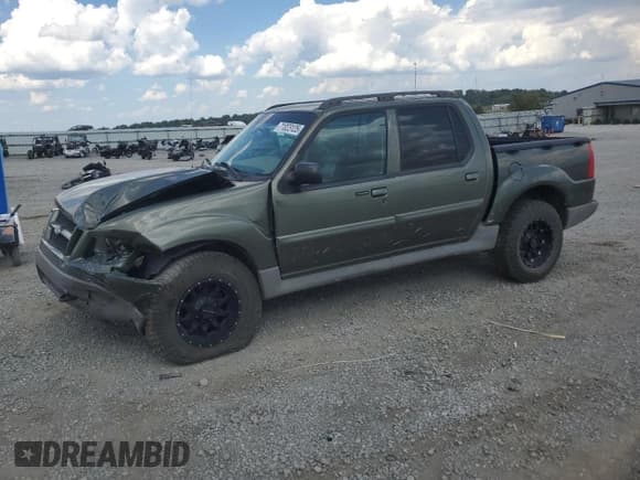 ✅ 2003 Ford Explorer Sport Trac XLS • VIN: 1FMZU77E23UA99709 • Lot: 71023125. Listed on Copart with 143,226 mi. Free auction sales archive from the USA and detailed vehicle history report at DreamBid. Image 1.
