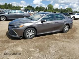 2021 Toyota Camry Hybrid LE with VIN 4T1C31AK4MU567560, listed as a Copart auction lot 70714425 with 185,505 mi miles and Salvage title. Bid and sale history available at DreamBid. Image 1.