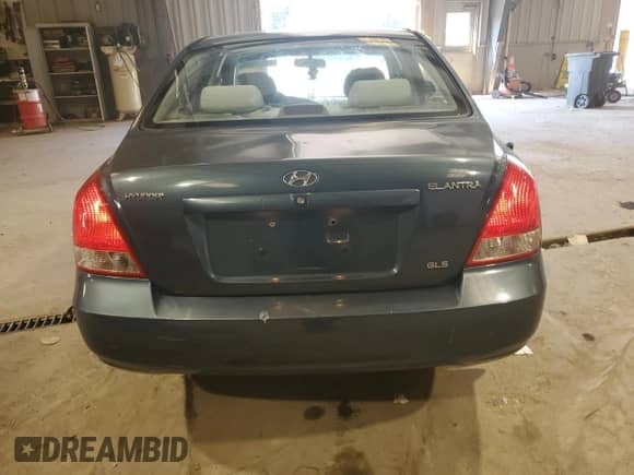 2003 Hyundai Elantra GLS z VIN KMHDN45D83U495806, wystawiony jako Copart lot #65962504 z przebiegiem 131 056 mil mil oraz Szkoda całkowita • Salvage title. Historia ofert i sprzedaży dostępna na DreamBid. Obrazek 6.