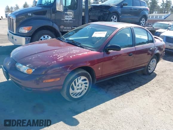 2002 Saturn SL z VIN 1G8ZF52852Z267004, wystawiony jako IAAI lot #41760974 z przebiegiem 228 165 mil mil oraz . Historia ofert i sprzedaży dostępna na DreamBid. Obrazek 2.