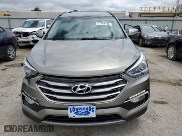 2017 Hyundai Santa Fe 2.0T z VIN 5XYZUDLA9HG437458, wystawiony jako Copart lot #57751415 z przebiegiem 117 469 mil mil oraz Szkoda całkowita • Salvage title. Historia ofert i sprzedaży dostępna na DreamBid. Obrazek 5.