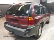 ✅ 2002 GMC Envoy SLT • VIN: 1GKDT13SX22426320 • Lot: 41709359. Listed on IAAI with 104,418 mi. Free auction sales archive from the USA and detailed vehicle history report at DreamBid. Image 4.