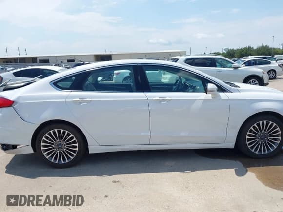 ✅ 2017 Ford Fusion Titanium • VIN: 3FA6P0K97HR114628 • Lot: 43023302. Listed on IAAI with 90,892 mi. Free auction sales archive from the USA and detailed vehicle history report at DreamBid. Image 13.