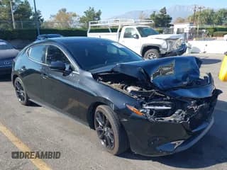 ✅ 2021 Mazda 3 2.5 Turbo • VIN: JM1BPBJY5M1348574 • Lot: 43611636. Listed on IAAI with 57,657 mi. Free auction sales archive from the USA and detailed vehicle history report at DreamBid. Image 1.