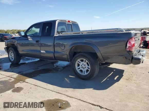 2003 Dodge Dakota Sport z VIN 1D7HL32X63S218920, wystawiony jako Copart lot #76013444 z przebiegiem 142 224 mil mil oraz Czysty tytuł • Clean title. Historia ofert i sprzedaży dostępna na DreamBid. Obrazek 2.