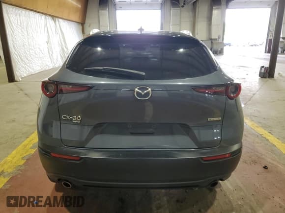 ✅ 2020 Mazda CX-30 Premium • VIN: 3MVDMBEM1LM110794 • Лот: 61779245. Опубликован ранее на Copart с пробегом Не указан. Бесплатный доступ к архиву аукционных продаж из США и подробный отчёт об истории автомобиля на DreamBid. Изображение 6.