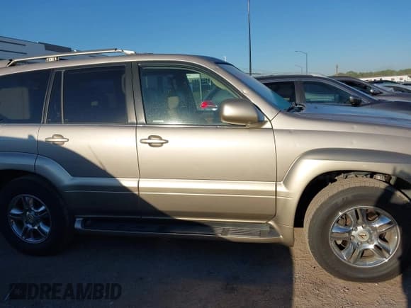 ✅ 2004 Lexus GX 470 • VIN: JTJBT20X340041301 • Lot: 43417852. Wystawiony na IAAI z przebiegiem 126 968 mil. Bezpłatny archiwum sprzedaży aukcyjnych z USA i szczegółowy raport historii pojazdu na DreamBid. Zdjęcie 13.