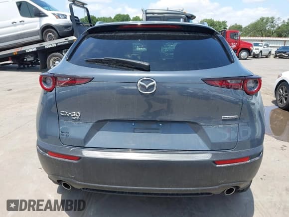 ✅ 2022 Mazda CX-30 S Carbon Edition • VIN: 3MVDMBCL6NM410330 • Lot: 42107426. Listed on IAAI with 30,277 mi. Free auction sales archive from the USA and detailed vehicle history report at DreamBid. Image 17.