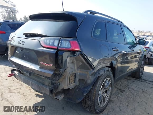 ✅ 2020 Jeep Cherokee Trailhawk • VIN: 1C4PJMBX2LD504382 • Lot: 42655367. Listed on IAAI with 98,055 mi. Free auction sales archive from the USA and detailed vehicle history report at DreamBid. Image 4.