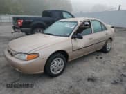 ✅ 1999 Ford Escort LX • VIN: 1FAFP10P4XW156726 • Lot: 84793665. Listed on Copart with 50,604 mi. Free auction sales archive from the USA and detailed vehicle history report at DreamBid. Image 1.