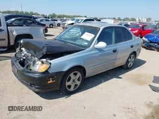 2003 Hyundai Accent GL z VIN KMHCG45C23U427238, wystawiony jako IAAI lot #43412077 z przebiegiem 111 107 mil mil oraz . Historia ofert i sprzedaży dostępna na DreamBid. Obrazek 2.