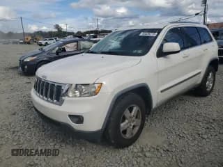 ✅ 2011 Jeep Grand Cherokee Laredo • VIN: 1J4RR4GG5BC562088 • Lot: 85536215. Listed on Copart with 151,797 mi. Free auction sales archive from the USA and detailed vehicle history report at DreamBid. Image 1.