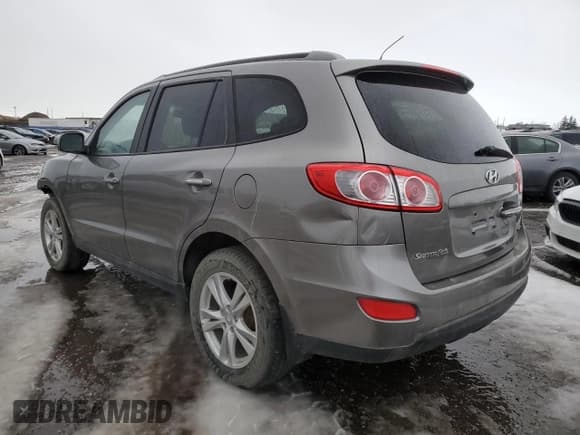 ✅ 2012 Hyundai Santa Fe SE • VIN: 5XYZHDAG8CG122087 • Lot: 87845555. Listed on Copart with Not provided. Free auction sales archive from the USA and detailed vehicle history report at DreamBid. Image 2.