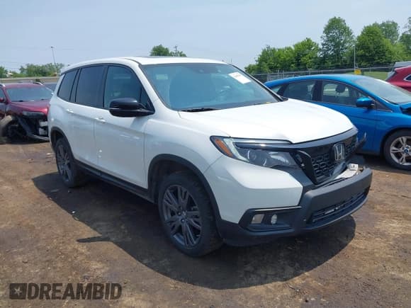 ✅ 2021 Honda Passport EX-L • VIN: 5FNYF8H59MB007097 • Lot: 42409181. Listed on IAAI with 74,410 mi. Free auction sales archive from the USA and detailed vehicle history report at DreamBid. Image 1.