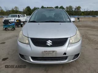 ✅ 2010 Suzuki SX4 LE • VIN: JS2YC5A21A6303767 • Лот: 72063074. Опубликован ранее на Copart с пробегом 114 140 миль. Бесплатный доступ к архиву аукционных продаж из США и подробный отчёт об истории автомобиля на DreamBid. Изображение 5.