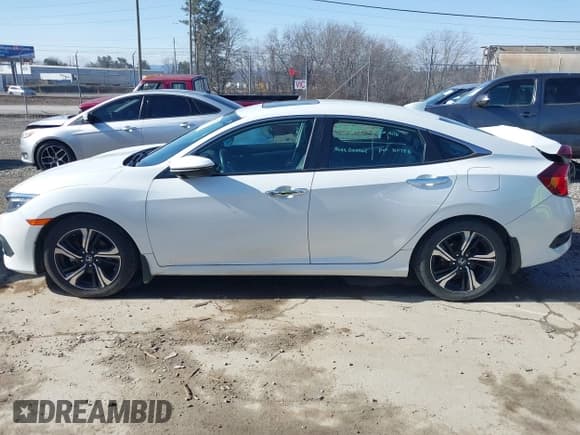 ✅ 2018 Honda Civic Touring • VIN: 19XFC1F90JE000926 • Lot: 41352528. Listed on IAAI with 134,052 mi. Free auction sales archive from the USA and detailed vehicle history report at DreamBid. Image 14.