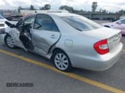 ✅ 2004 Toyota Camry LE • VIN: 4T1BF32KX4U577765 • Lot: 43725664. Listed on IAAI with 105,989 mi. Free auction sales archive from the USA and detailed vehicle history report at DreamBid. Image 3.