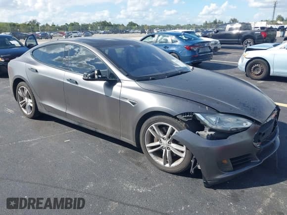 ✅ 2013 Tesla Model S • VIN: 5YJSA1AG0DFP08215 • Lot: 43539114. Listed on IAAI with 60,877 mi. Free auction sales archive from the USA and detailed vehicle history report at DreamBid. Image 1.
