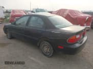 ✅ 1997 Mazda Protege DX • VIN: JM1BC1418V0165780 • Lot: 42735711. Wystawiony na IAAI z przebiegiem 65 652 mil. Bezpłatny archiwum sprzedaży aukcyjnych z USA i szczegółowy raport historii pojazdu na DreamBid. Zdjęcie 3.