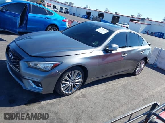✅ 2021 Infiniti Q50 Luxe • VIN: JN1EV7BP8MM705608 • Lot: 43530219. Listed on IAAI with 63,043 mi. Free auction sales archive from the USA and detailed vehicle history report at DreamBid. Image 14.
