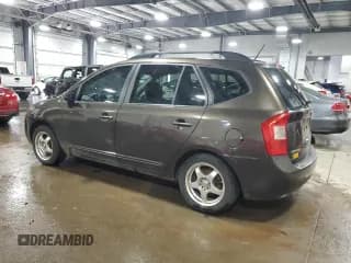 ✅ 2009 Kia Rondo LX • VIN: KNAFG528397269679 • Лот: 64802864. Опубликован ранее на Copart с пробегом 160 936 миль. Бесплатный доступ к архиву аукционных продаж из США и подробный отчёт об истории автомобиля на DreamBid. Изображение 2.