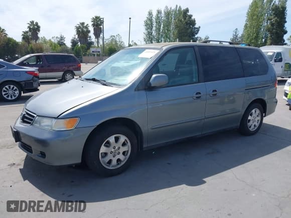 ✅ 2002 Honda Odyssey EX-L • VIN: 2HKRL18702H537396 • Lot: 42097471. Listed on IAAI with 291,432 mi. Free auction sales archive from the USA and detailed vehicle history report at DreamBid. Image 2.