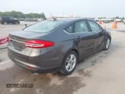✅ 2018 Ford Fusion SE • VIN: 3FA6P0H71JR270532 • Лот: 43126845. Опубликован ранее на IAAI с пробегом 132 488 миль. Бесплатный доступ к архиву аукционных продаж из США и подробный отчёт об истории автомобиля на DreamBid. Изображение 4.