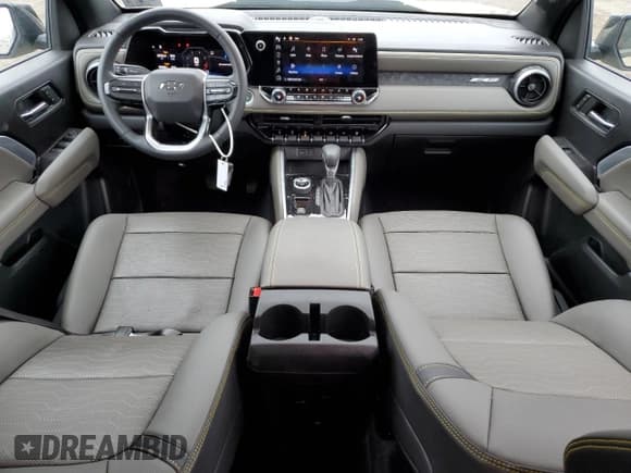 ✅ 2023 Chevrolet Colorado 4WD ZR2 • VIN: 1GCPTFEK6P1212067 • Лот: 68128724. Опубликован ранее на Copart с пробегом 12 859 миль. Бесплатный доступ к архиву аукционных продаж из США и подробный отчёт об истории автомобиля на DreamBid. Изображение 8.