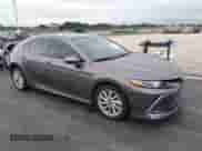 2022 Toyota Camry LE with VIN 4T1C11AK0NU653830, listed as a IAAI auction lot 43428154 with 21,960 mi miles and . Bid and sale history available at DreamBid. Image 1.